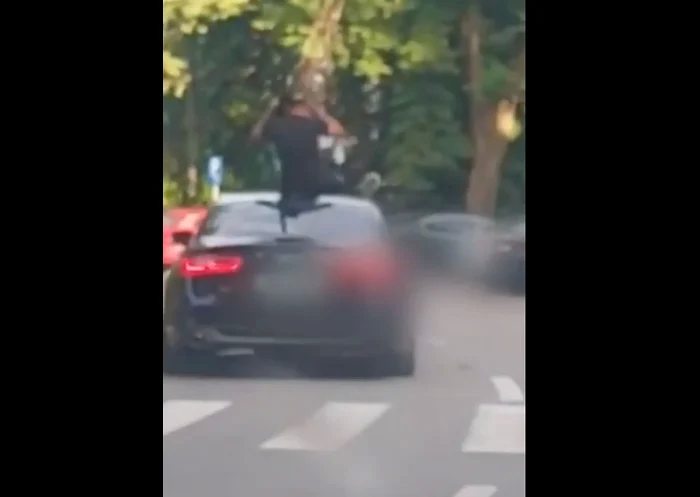 ---------Brbai-surprini-pe-capota-unei-maini-n-timp-ce-ndreptau-o-arm-ctre-trectori-VIDEO