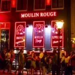 Rețea de proxenetism destructurată între Cartierul Roșu din Amsterdam și România: șapte arestări
