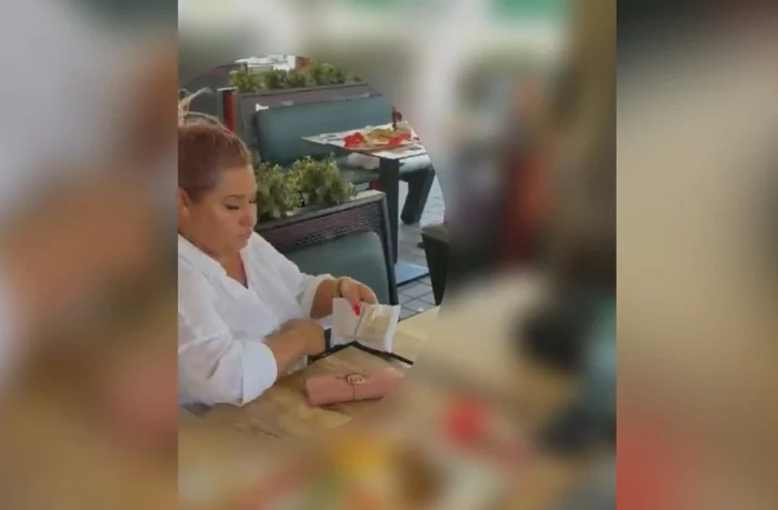 O femeie prinsă în flagrant cu 7.500 de euro pentru urgentarea unui dosar de redobândire a cetățeniei